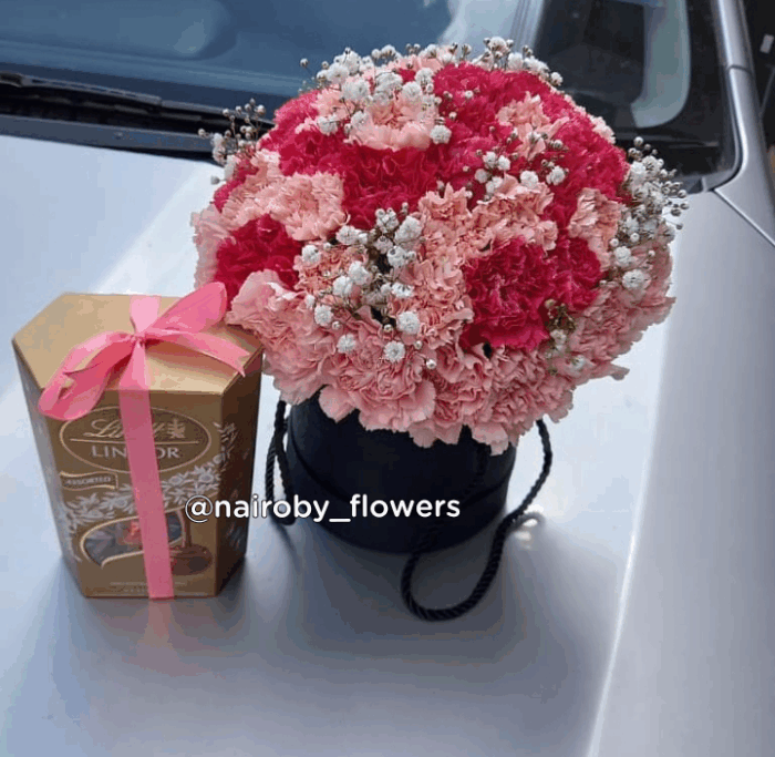 CARNATIONS BOX WITH CHOCOLATE.
