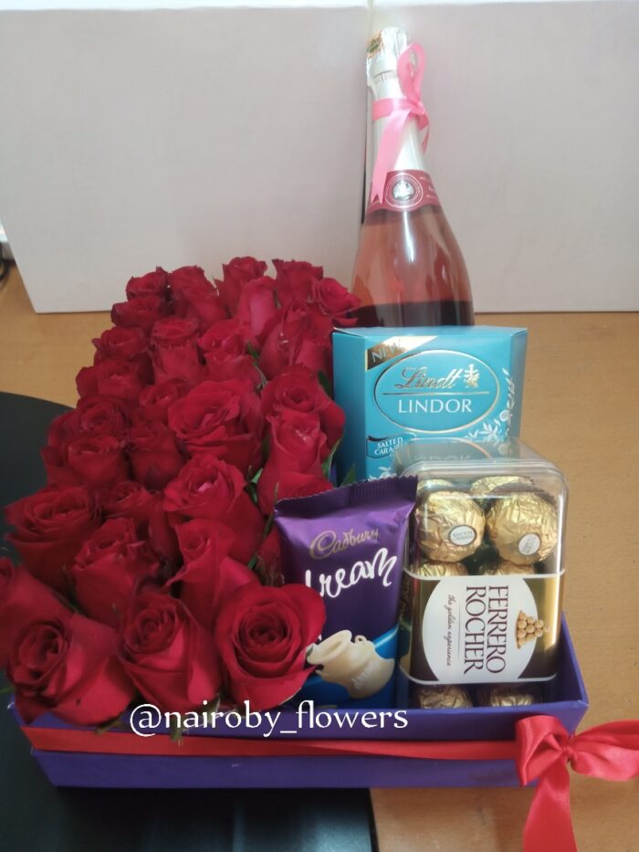 BOX OF GOODIES AND RED ROSES