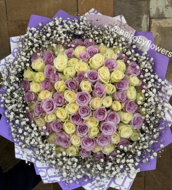 100 PURPLE AND WHITE ROSES WITH BABY BREATH RIM
